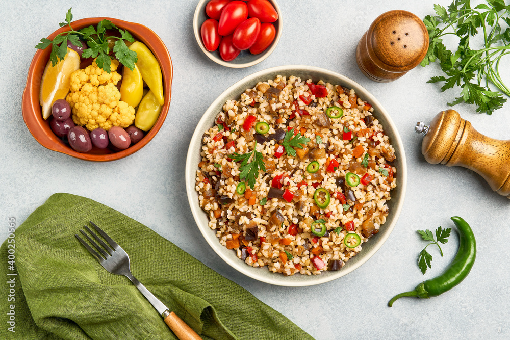 Bulgur pilaf with eggplant and vegetables. Top view Bulgur pilaf with eggplant and vegetables. Top view