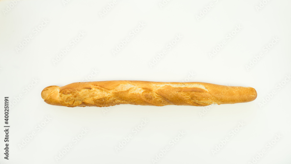 Fresh and crispy French baguettes on a white plate. Isolate Fresh and crispy French baguettes on a white plate. Isolate