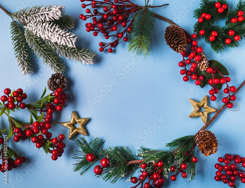 Festive Christmas and new year decorations with gift boxes ,balls, cones on blue background