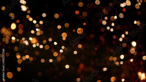 Fireworks background with blurred lights on black background