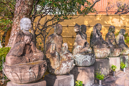 Six statues of sitting Jizo bodhisattva or Jizo Bosatsu known as protectors of travelers and registered as cultural property in the Tamonji Temple of Sumida ward. photo