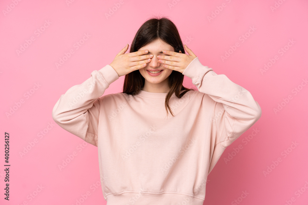 Young Ukrainian teenager girl over isolated pink background covering eyes by hands Young Ukrainian teenager girl over isolated pink background covering eyes by hands