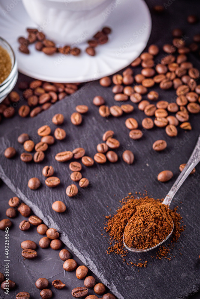 cup of fragrant fresh coffee on a dark stone background