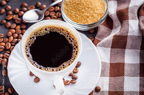 cup of fragrant fresh coffee on a dark stone background © Narsil