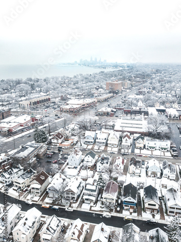 Lakewood Ohio homes and cleveland skyline in winter after a storm