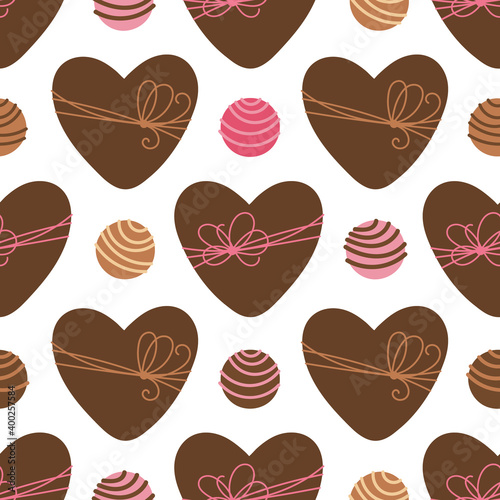 Vector seamless pattern with heart shaped box and chocolate candies. Brown color heart boxes with ribbon bow. Valentines Day background for wrapping paper, wrapper, packaging, fabric and print, etc.
