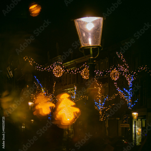 Beautiful illuminated and decorated Rechtstraat in Wyck, Maastricht ready to receive customers in the local shops to buy the annual Christmas gifts. photo