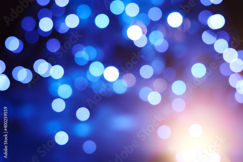 Fotografija Christmas tree with garlands out of focus