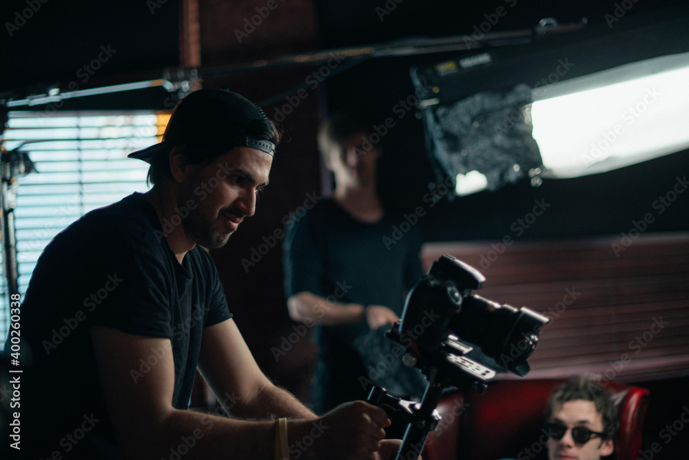 Director of photography with a camera in his hands on the set.