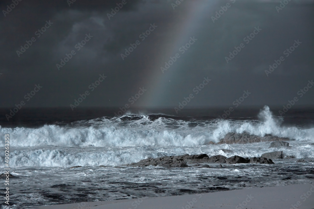 Stormy seascape with rainbow