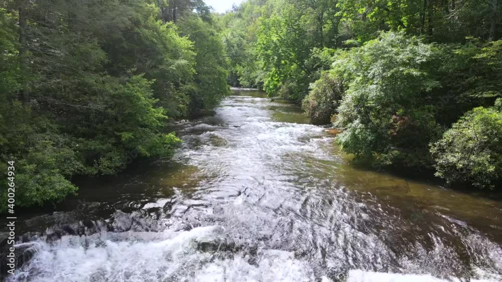 2020 - An excellent aerial shot of a river feeding into a waterfall in North Carolina.
