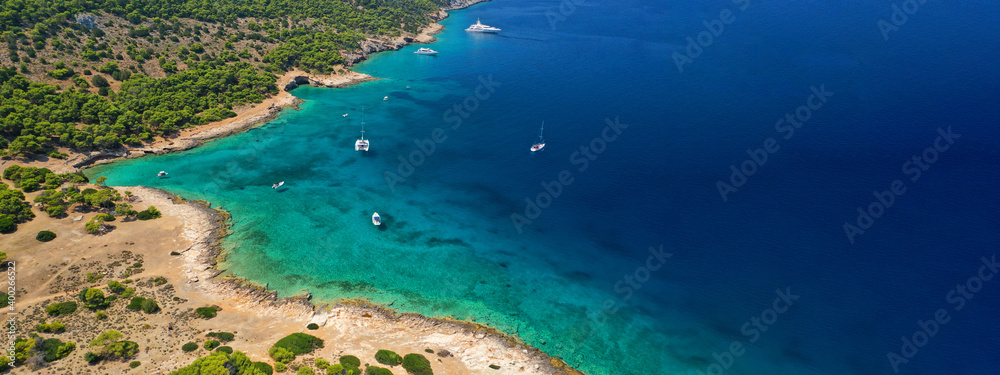 Aerial drone ultra wide panoramic photo of tropical exotic mediterranean bay with luxurious yachts and turquoise crystal clear sea