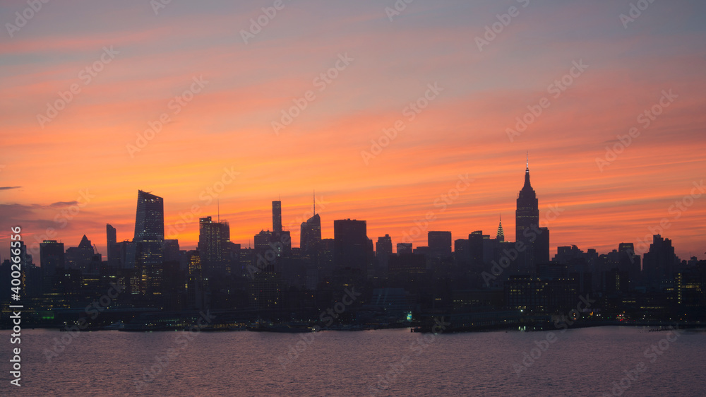 USA, New York State, New York City, Silhouette of city skyline at sunrise USA, New York State, New York City, Silhouette of city skyline at sunrise