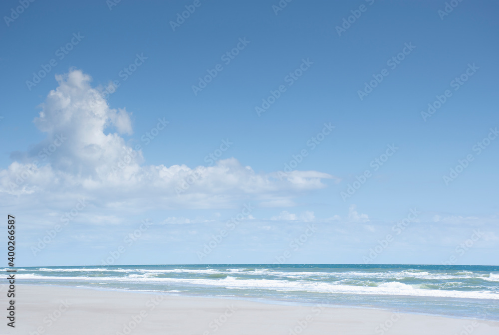 Blue sky and clouds above sea