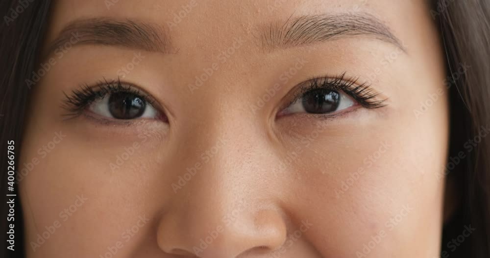 Face of beautiful woman blinking her eyes