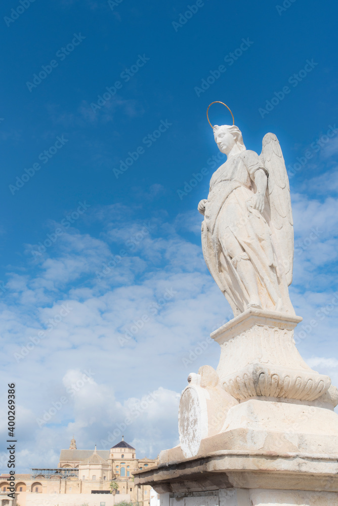 Spain, Andalusia,Cordoba, Statue of San Rafael against clouds Spain, Andalusia,Cordoba, Statue of San Rafael against clouds