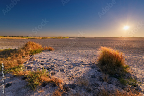 Ukraine, Dnepropetrovsk Region, Novomoskovskiy District, Lake Soleniy Lyman, Desert at sunset photo