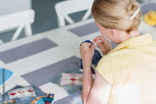 Woman making quilt photo