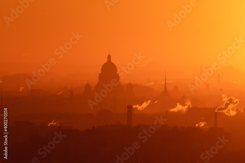 Aerial panoramic view of Saint-Petersburg  Russia  with St. Isaac s cathedral  the Winter Palace and Admiralty  with beautiful vibrant red orange sunset sundown  dusk cityscape silhouette scenery