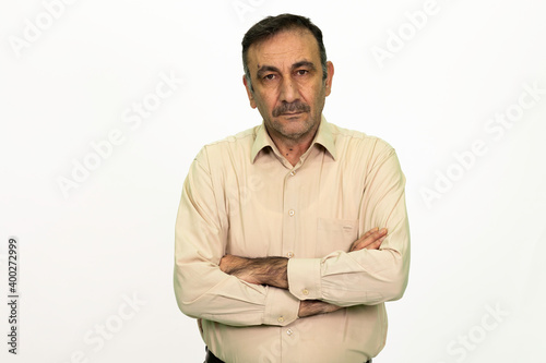 Mature male model posing at studio. White background and isolated image
