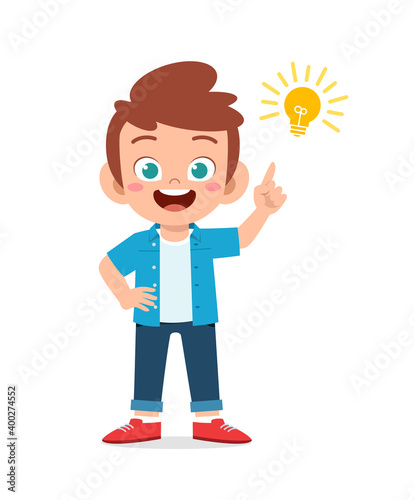 happy cute little kid boy with idea lamp sign
