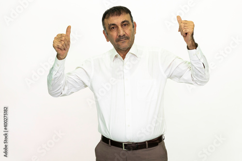 Man wearing a white shirt and fabric pants. Isolated image white background.