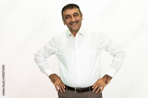 Man wearing a white shirt and fabric pants. Isolated image white background.