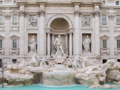 A front view of the famous Trevi Fountain in Rome, which was designed by Nicola Salvi and completed by Giuseppe Pannini and several others.