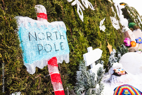 Christmas decoration of a signpost of the luminous North Pole.