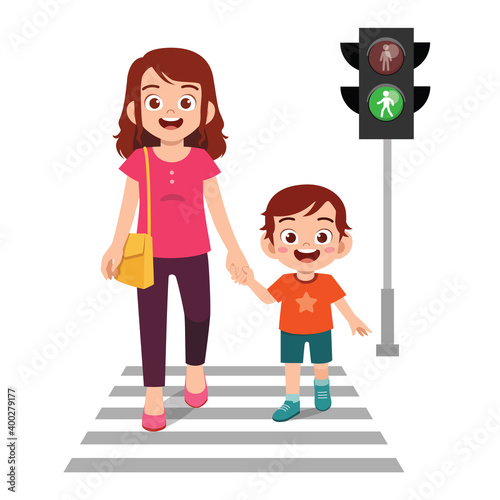Bilde på lerret happy cute little kid boy cross the road with mother