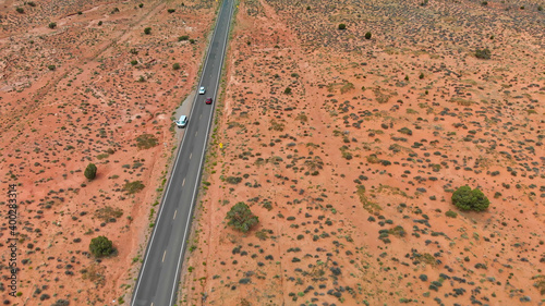 Countryside road through the fabulous Monument Valley in summser season, aerial view from drone photo