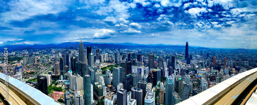 KUALA LUMPUR  MALAYSIA - DECEMBER 28  2019  Amazing panoramic city skyline from city rooftop on a beautiful sunny morning