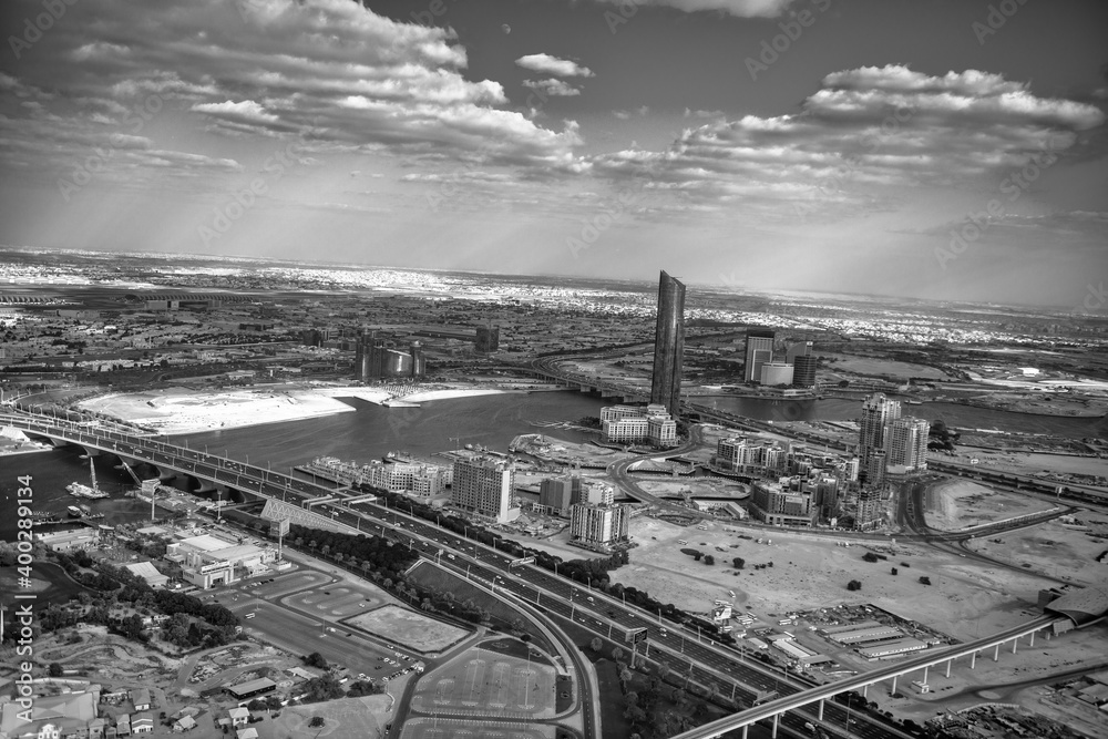 DUBAI, UAE - DECEMBER 10, 2016: Aerial view of Downtown Dubai from helicopter at sunset DUBAI, UAE - DECEMBER 10, 2016: Aerial view of Downtown Dubai from helicopter at sunset