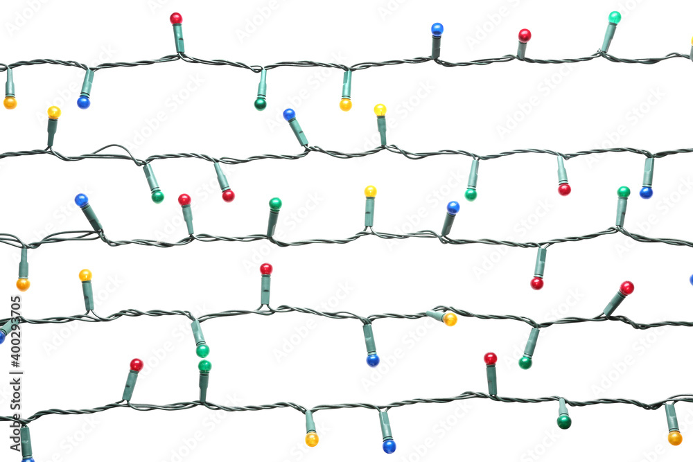 Christmas lights on white background. Festive decoration Christmas lights on white background. Festive decoration