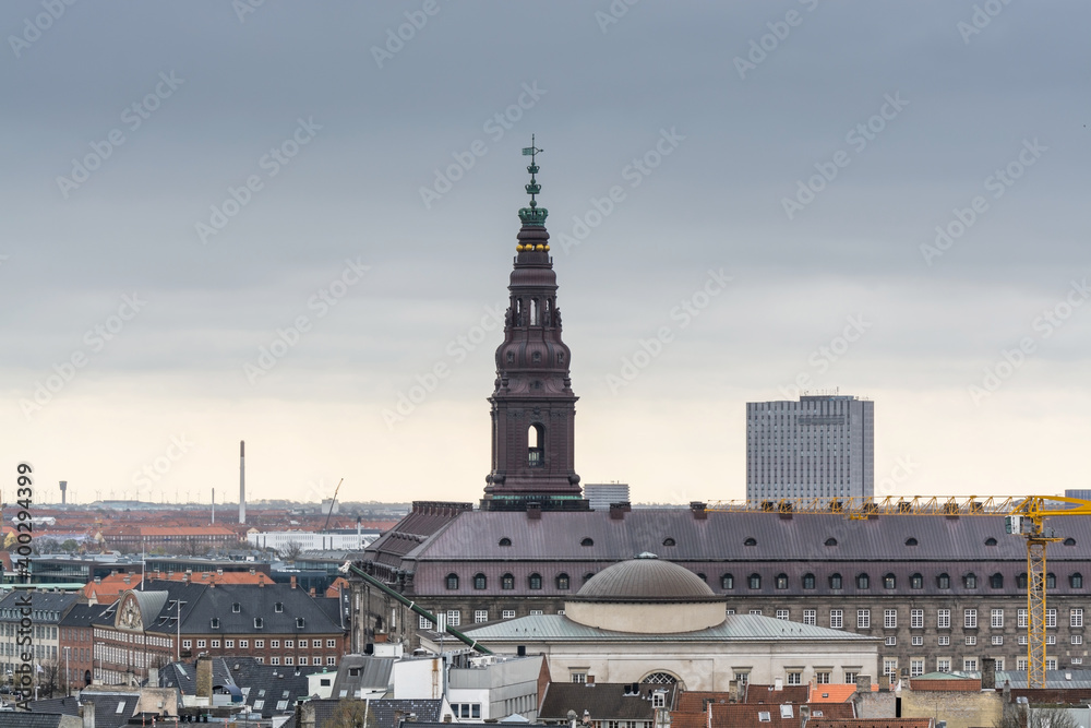 Aerial view of old downtown of Copenhagen City from the The Round Tower (Rundetaarn),  and Christiansborg Palace, a palace and government building on the islet of Slotsholmen in central Copenhagen