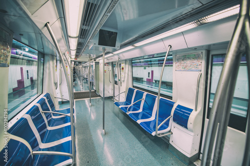 Interior of subway train with empty seats