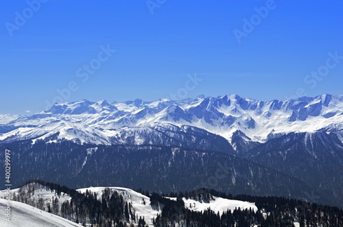 Winter landscape in the mountains with peaks and gorges, freestyle trails.
