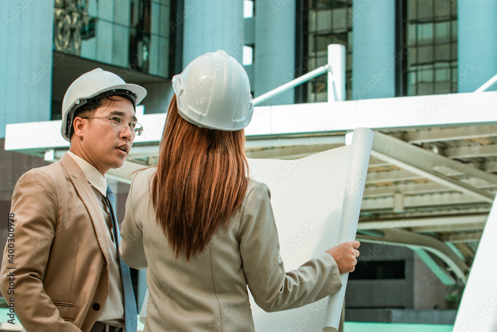 Two engineers meeting at construction site. Coworkers discussing. Boss and worker argue. Conversation in team. Two engineers meeting at construction site. Coworkers discussing. Boss and worker argue. Conversation in team.