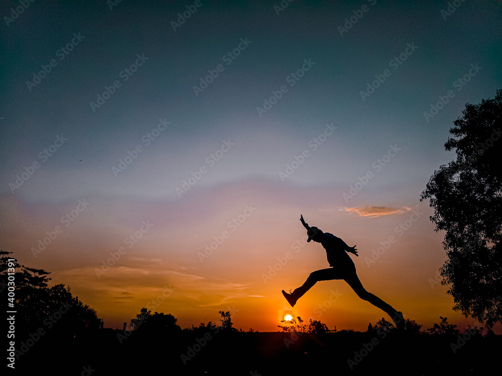 silhouette of person jumping silhouette of person jumping