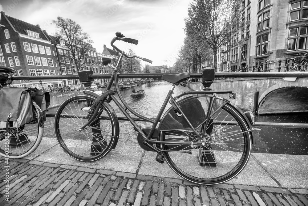 Blue bike in front of Amsterdam canals, The Netherlands Blue bike in front of Amsterdam canals, The Netherlands