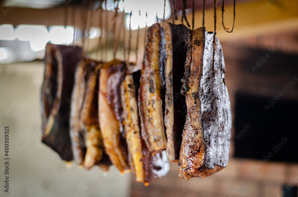 Traditional smoked pork muscles hung on dry - obrazy, fototapety, plakaty 