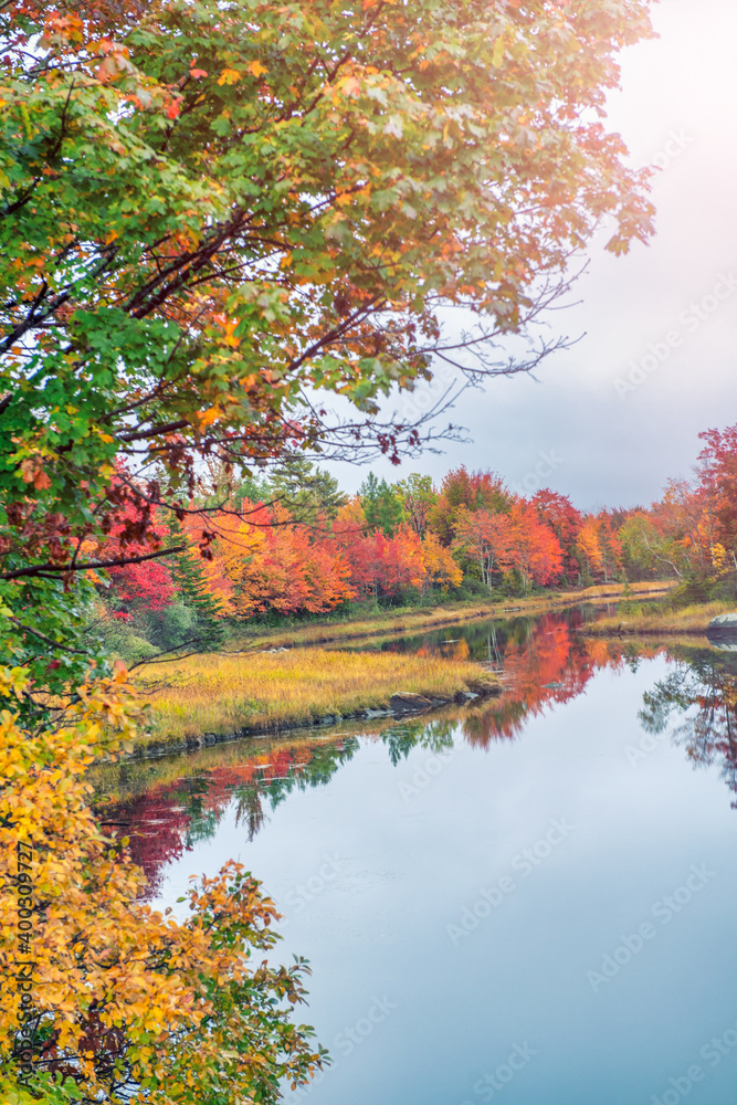 New England Lake reflections in foliage season, USA