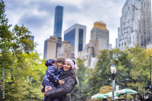 Tourists in New York. Mother and daughter embracing in Central Park