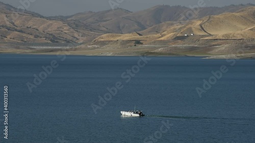 fishing boat on a reservoir photo