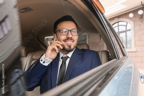 Successful businessman in modern car © Pixel-Shot