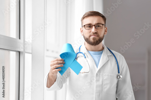 Doctor with blue ribbon in ...