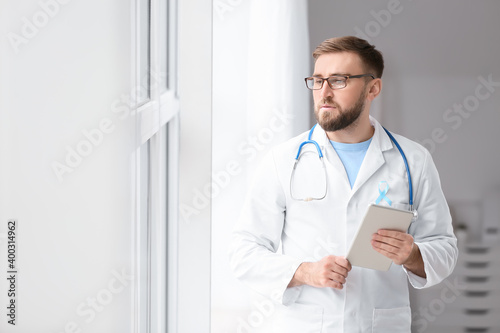 Doctor with blue ribbon and...