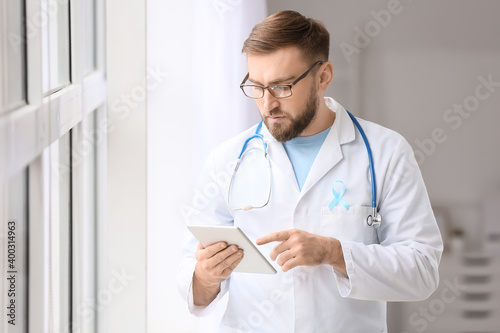 Doctor with blue ribbon and...