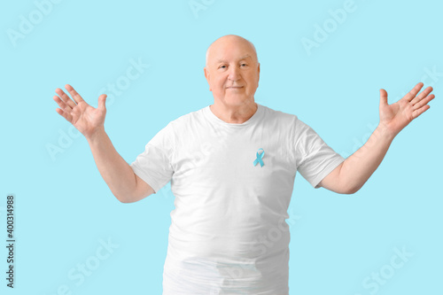 Senior man with blue ribbon...