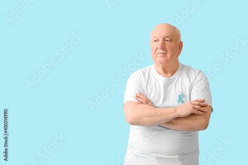Senior man with blue ribbon...